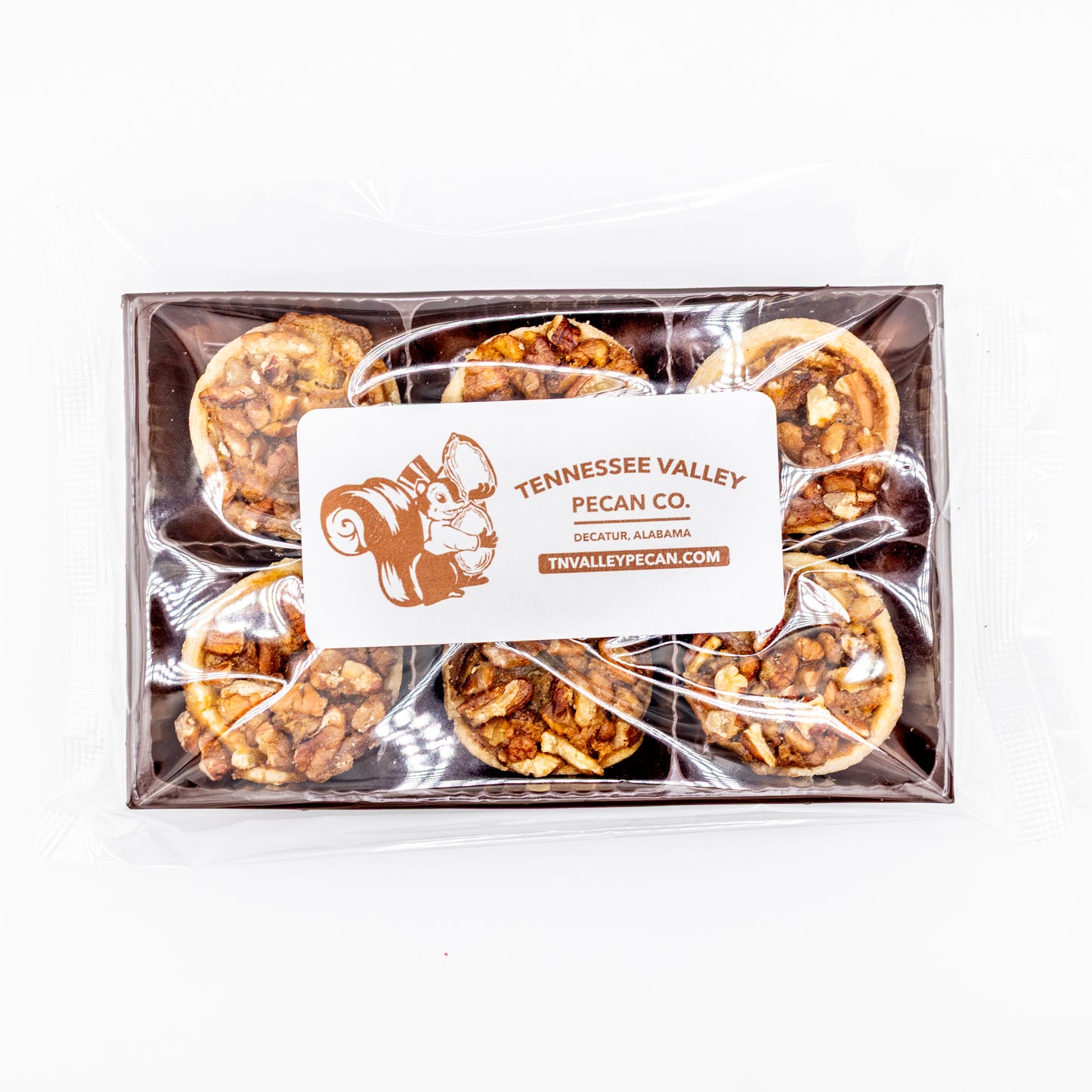 Box of Tennessee Valley Pecan Co. pecan pie bites with cleart packaging on a white background