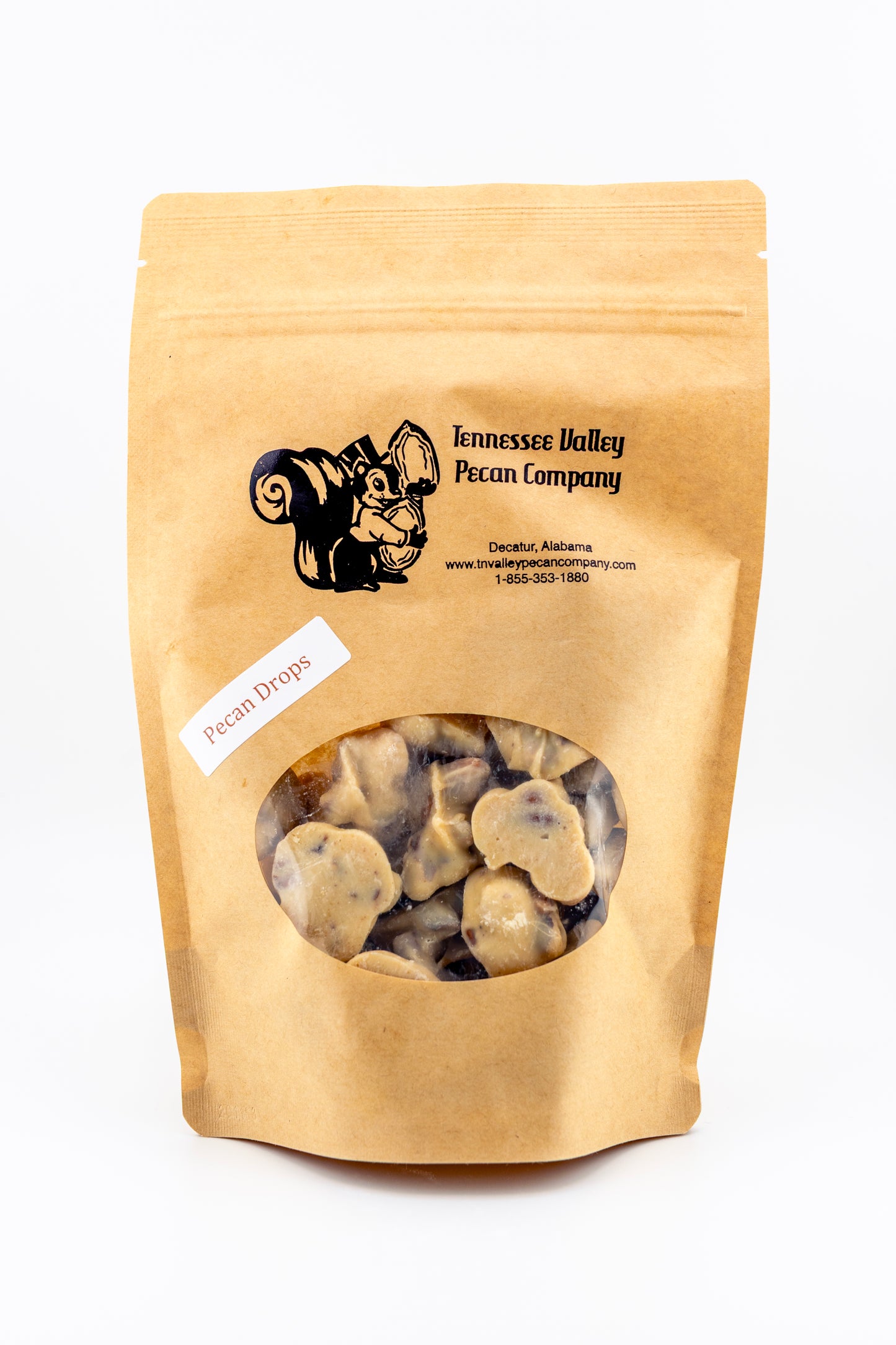 Kraft paper bag of Tennessee Valley Pecan Company pecan drops on a white background
