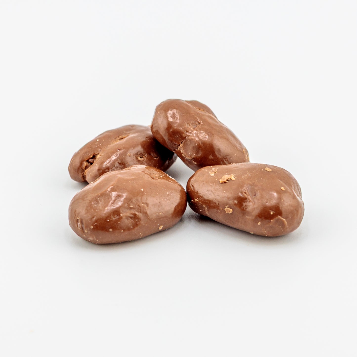 Milk Chocolate Pecans on a white background