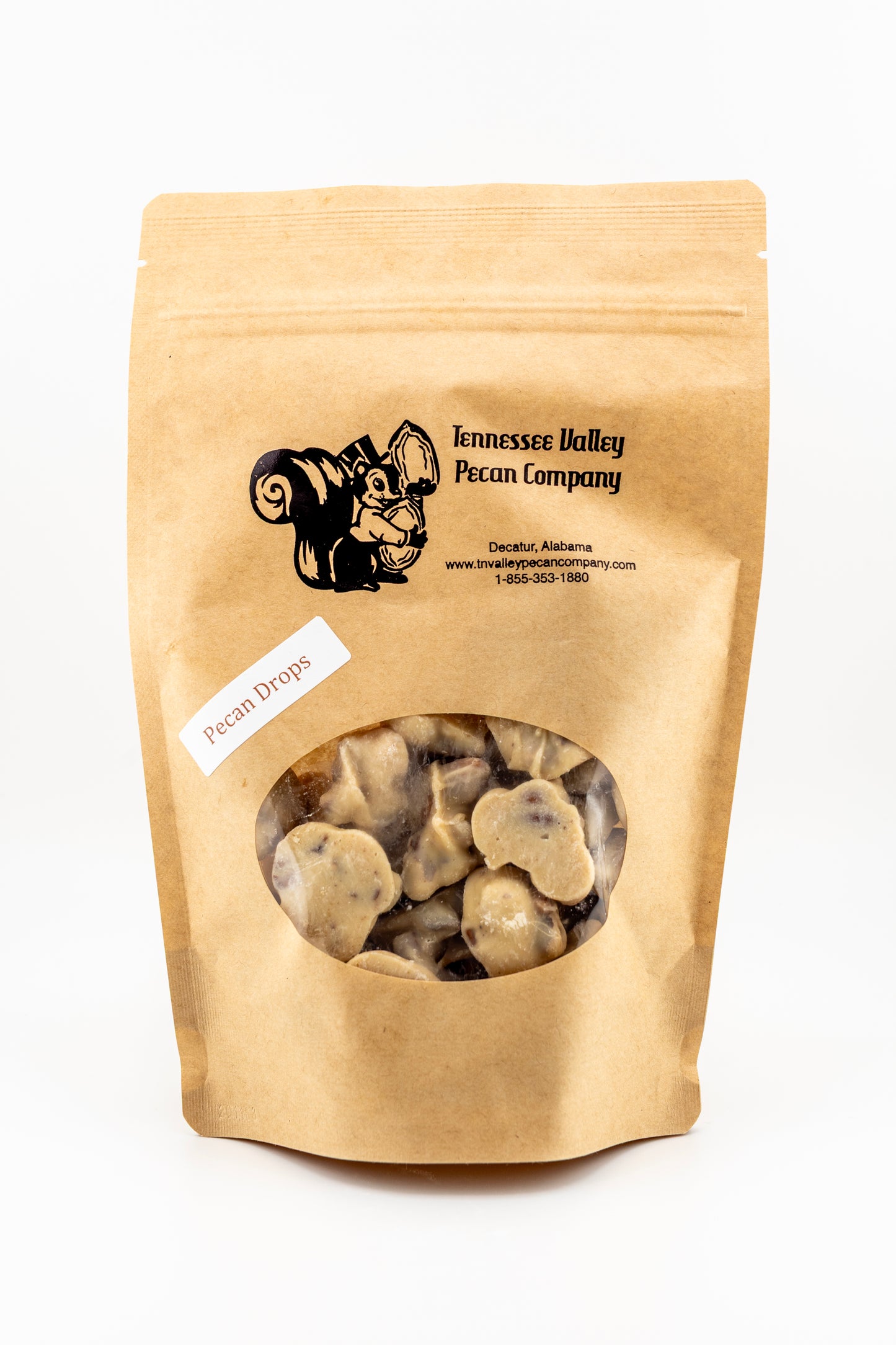 8 oz Kraft paper bag of Tennessee Valley Pecan Company pecan drops on a white background