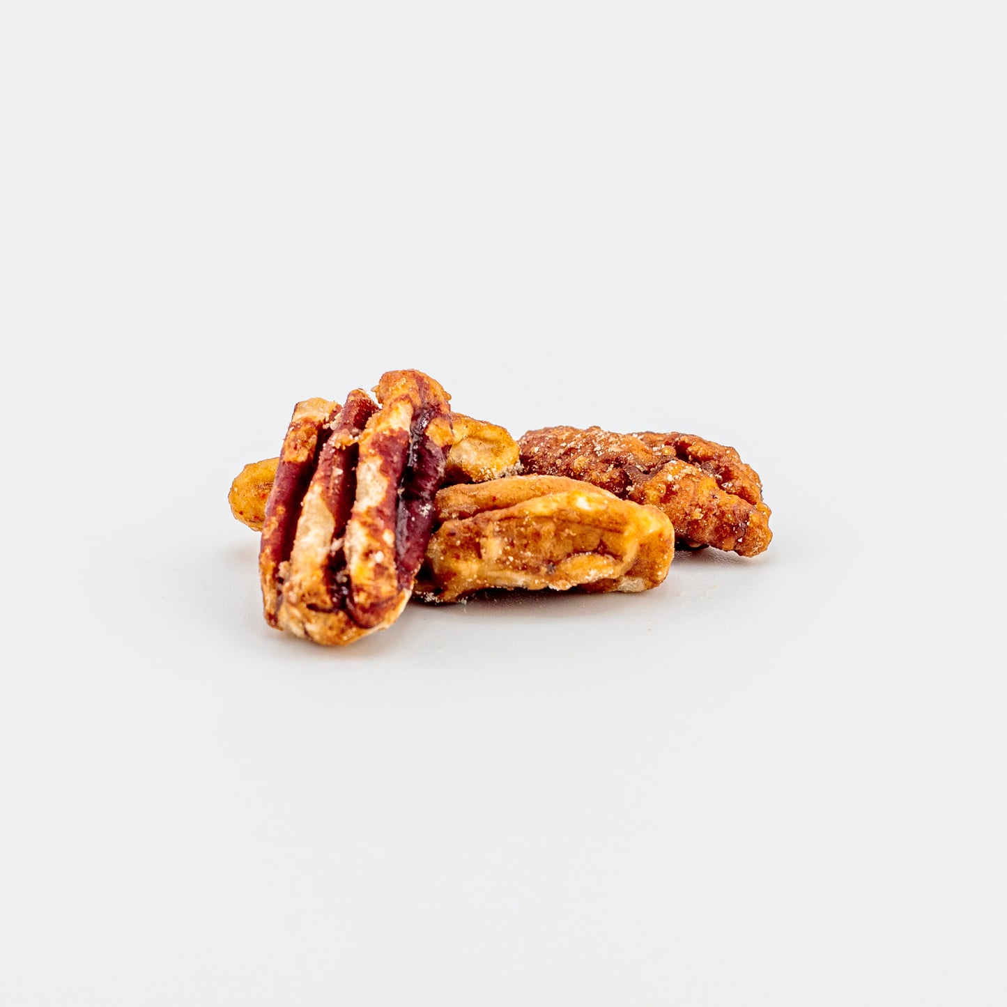 Sweet heat pecans on a white background