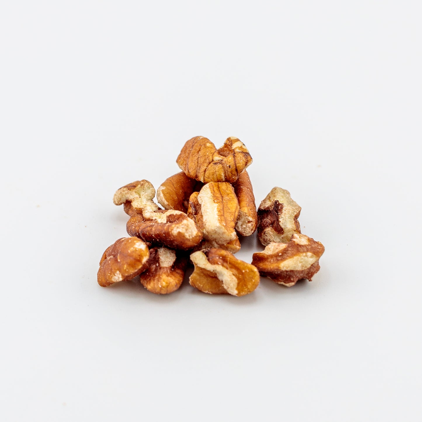Pile of Pecan Pieces on a white background