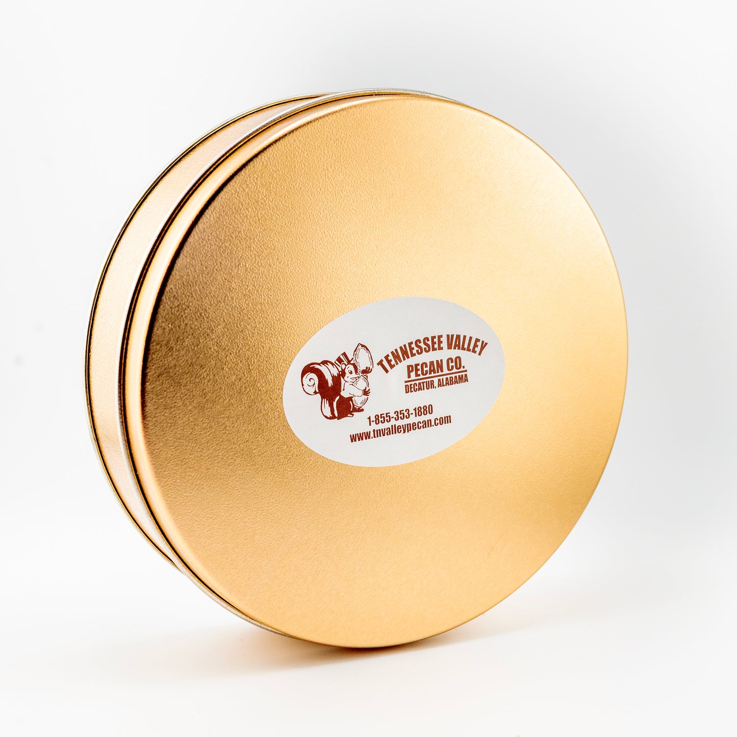 Gold tin with a label on a white background