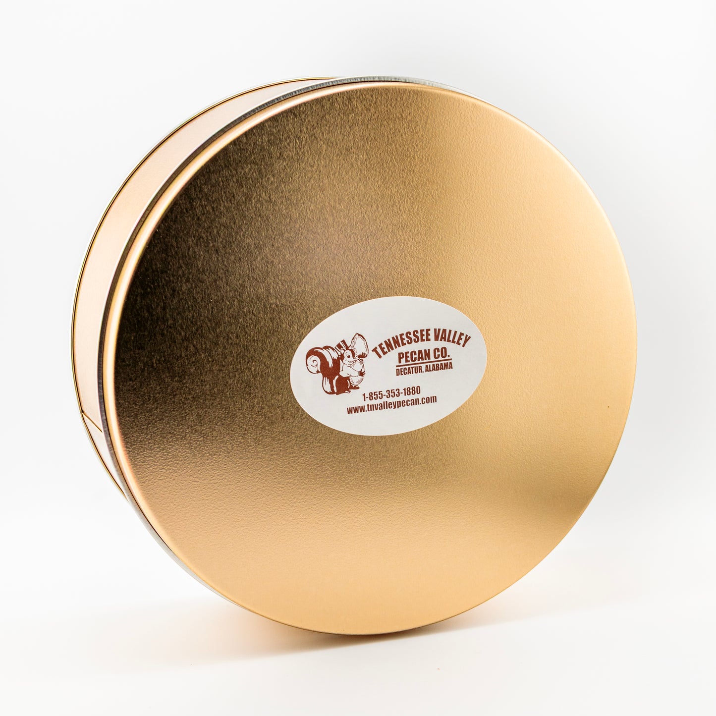 Gold round tin with a label on a white background