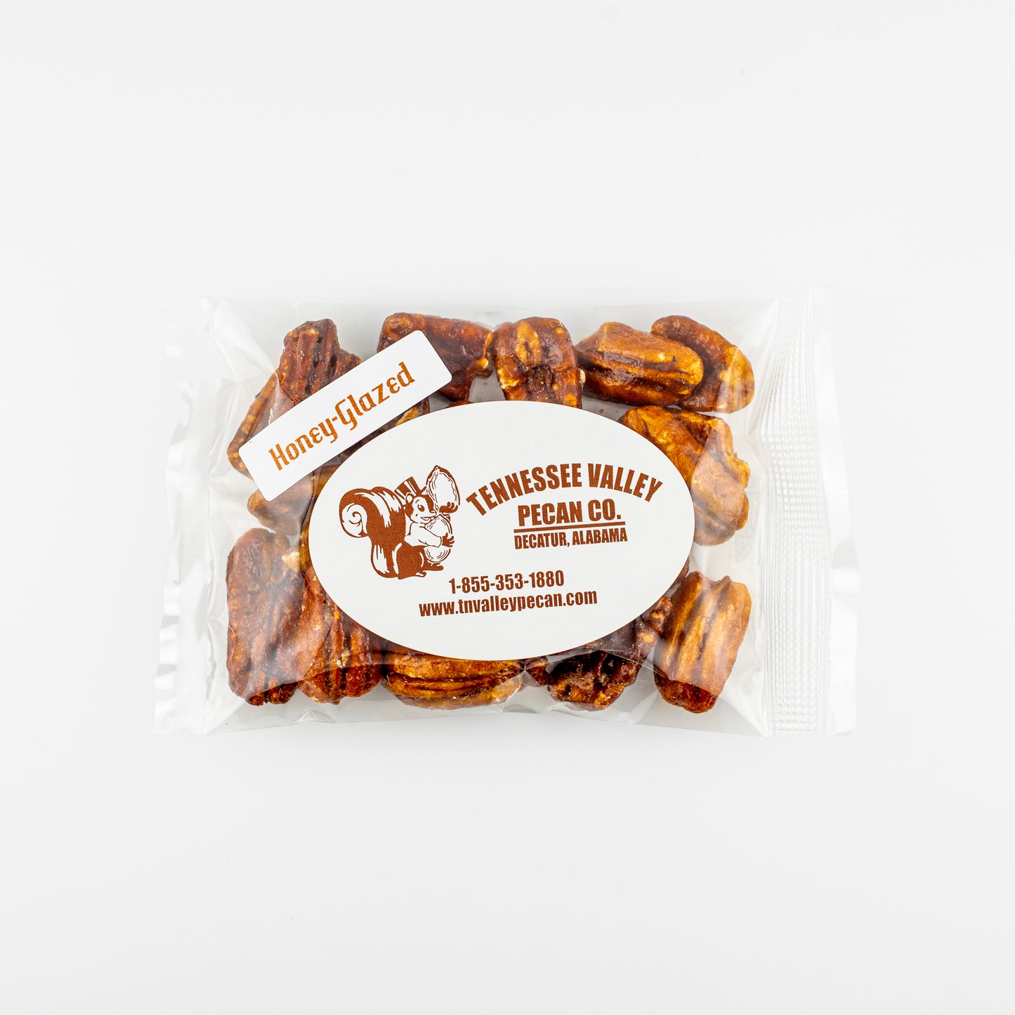 Packaged honey-glazed pecans with Tennessee Valley Pecan Co. branding on a white background