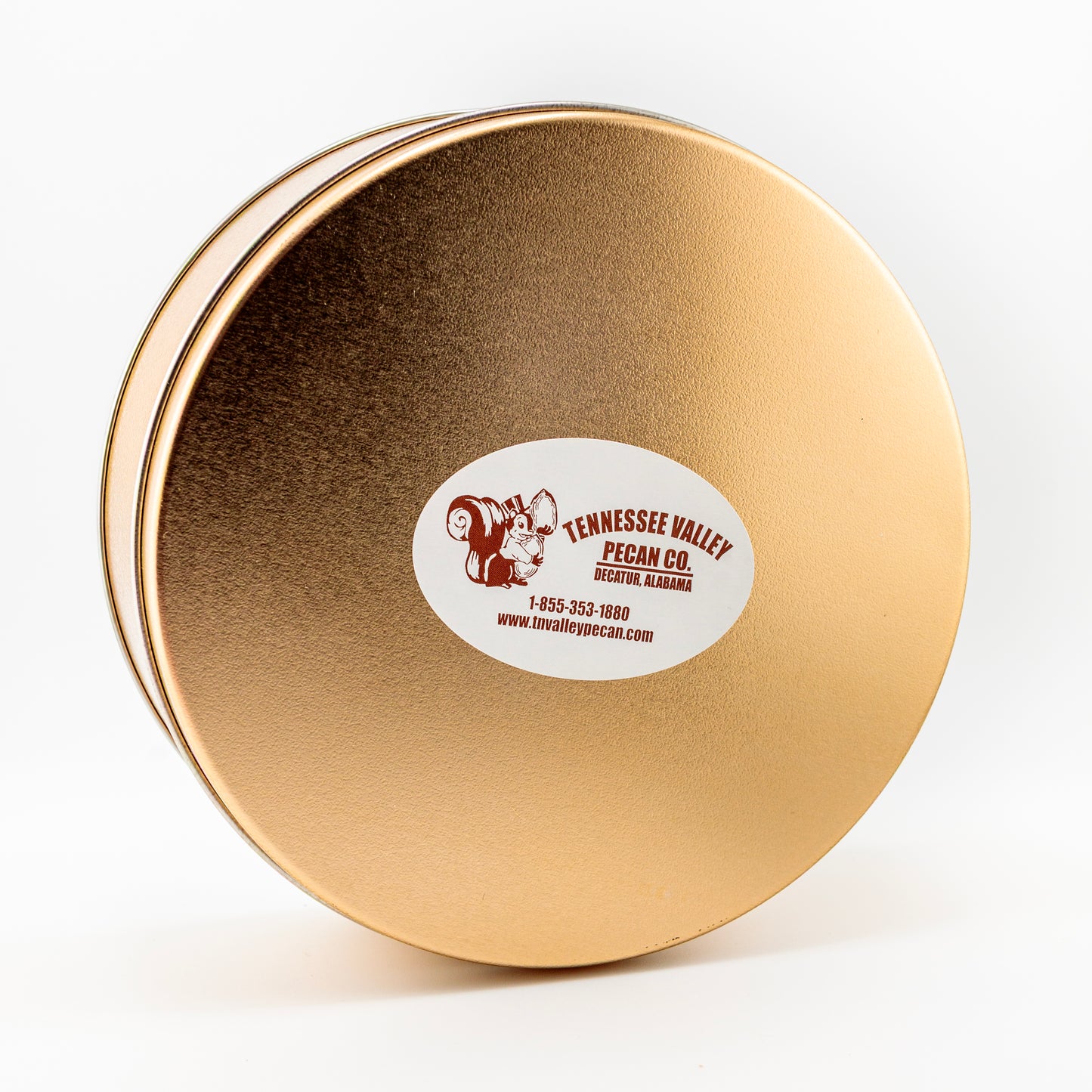 Gold round tin with a label on a white background