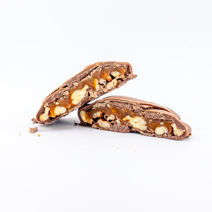 Chocolate chubbie with nuts cut in half on a white background