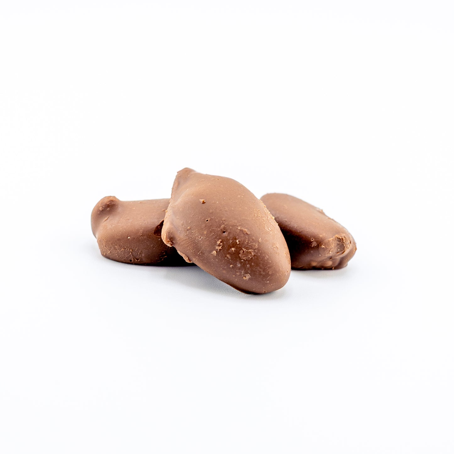 Premium Milk Chocolate Pecans on a white background 