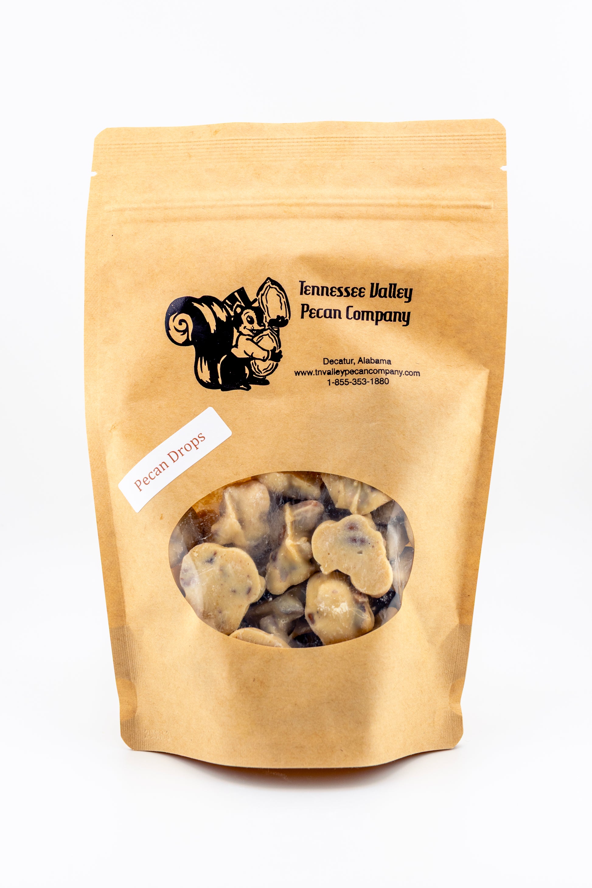 Kraft paper bag of Tennessee Valley Pecan Company pecan drops on a white background