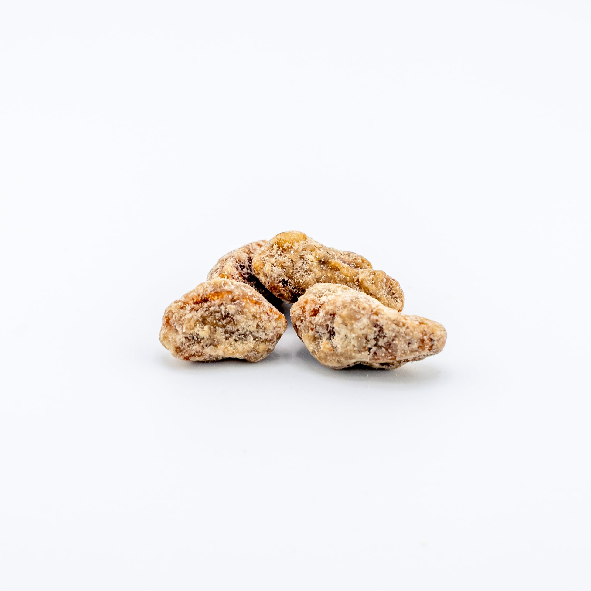 Praline Sugar Pecans on a white background