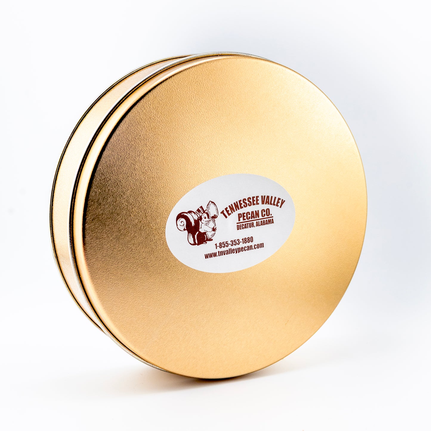Gold round tin with a tennessee valley pecan label on a white background