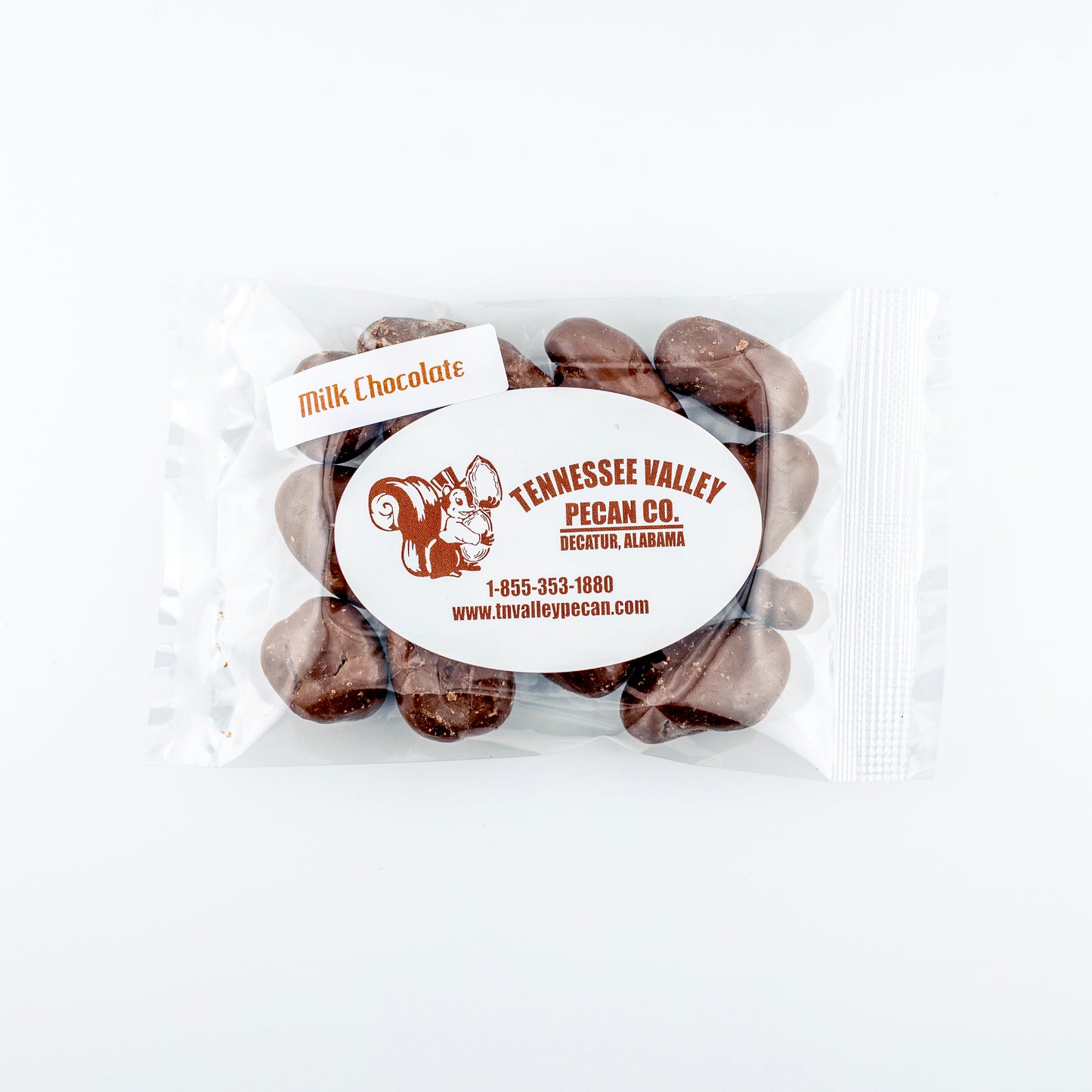 Packaged milk chocolate pecans with Tennessee Valley Pecan Co. label on a white background