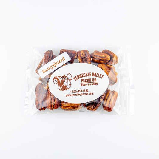 Packaged honey-glazed pecans with Tennessee Valley Pecan Co. label on a white background