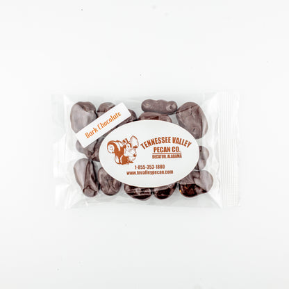 Pack of dark chocolate-covered pecans with Tennessee Valley Pecan Co. branding on a white background