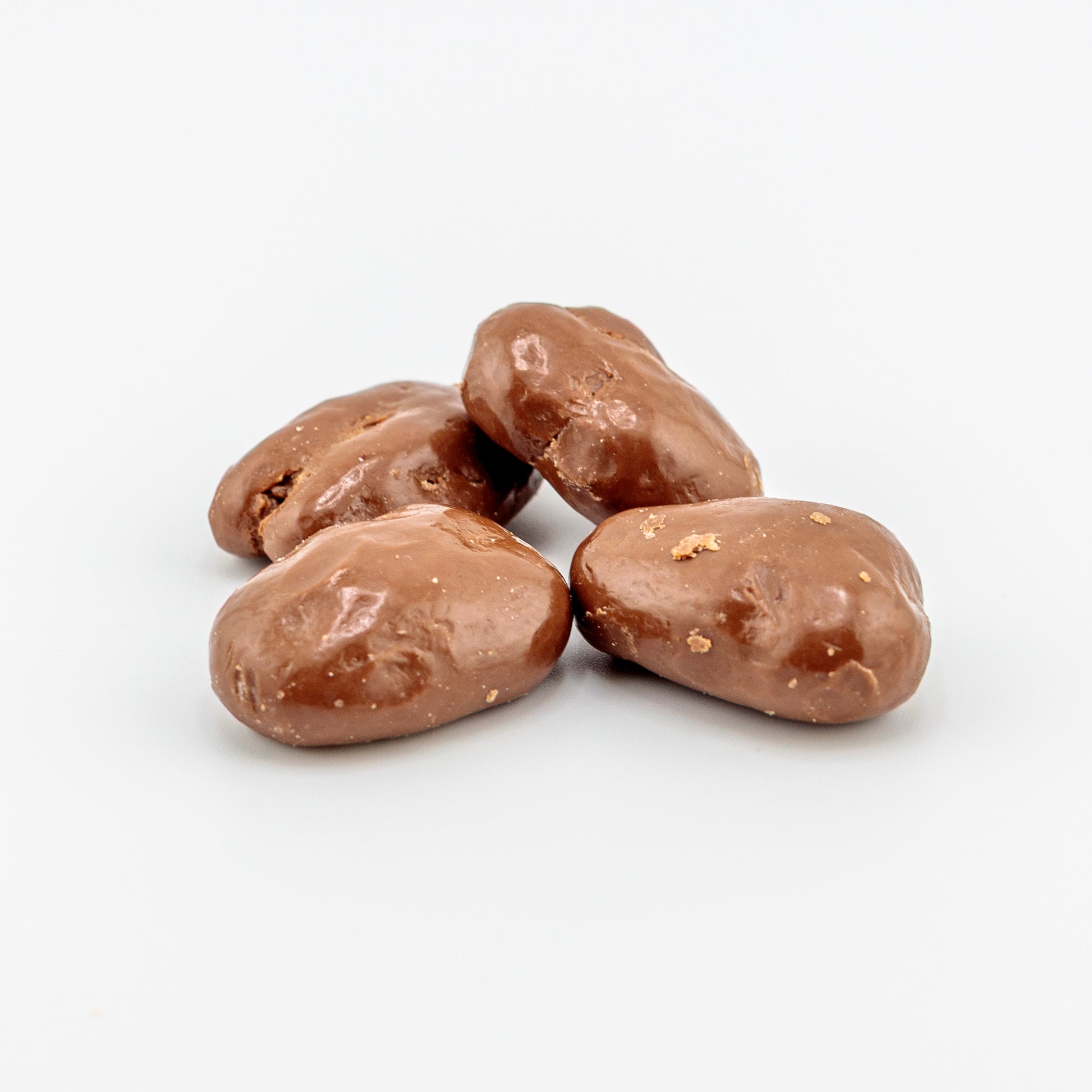 Milk Chocolate Pecans on a white background