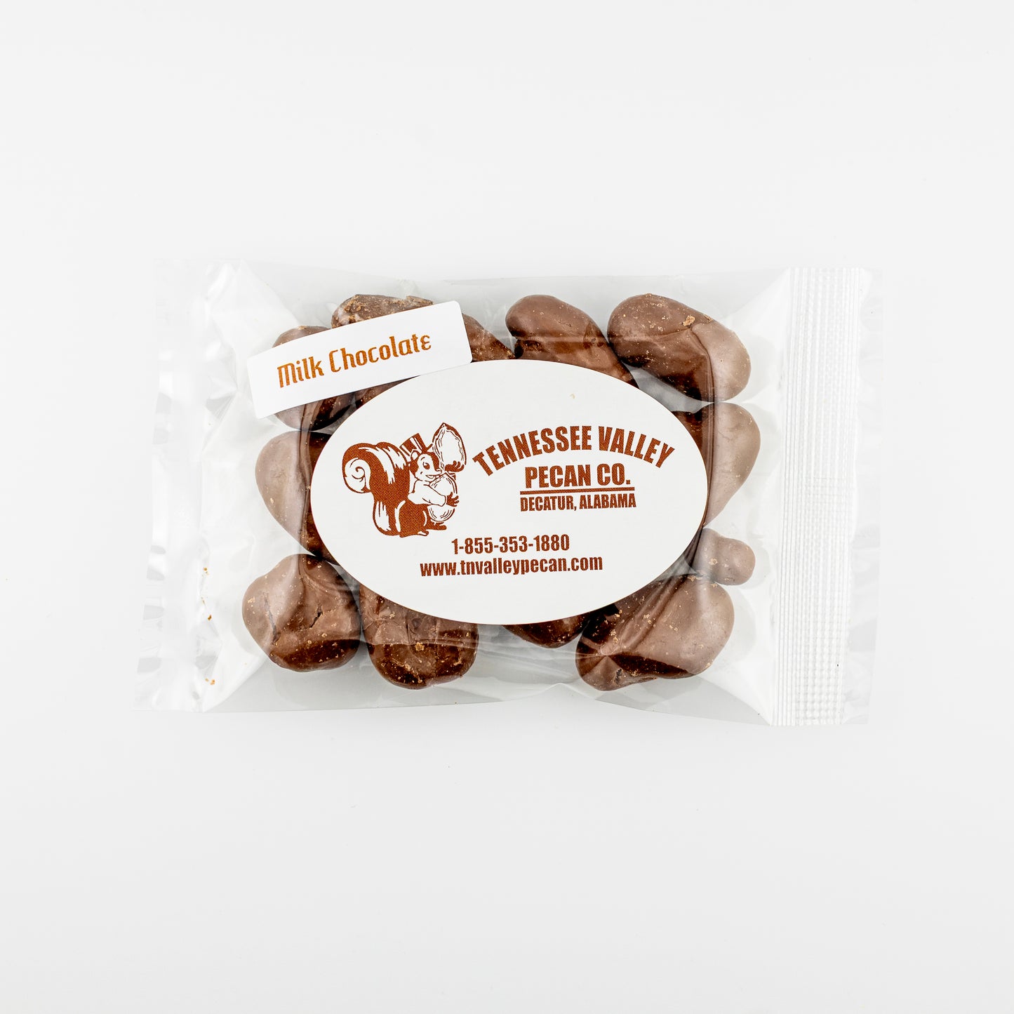 Packaged milk chocolate pecans with Tennessee Valley Pecan Co. label on a white background