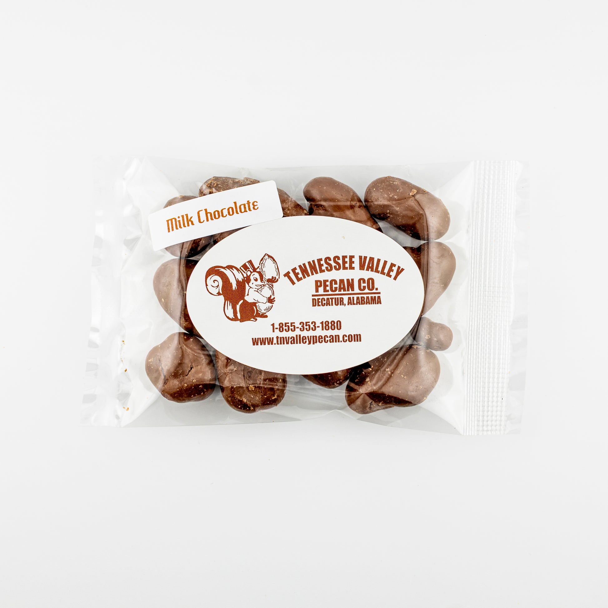 Packaged milk chocolate pecans with Tennessee Valley Pecan Co. label on a white background