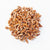 large pecan pieces on white background