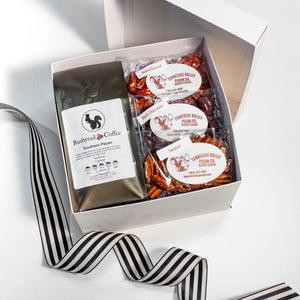 white gift box with coffee and pecans with black and white cabana ribbon
